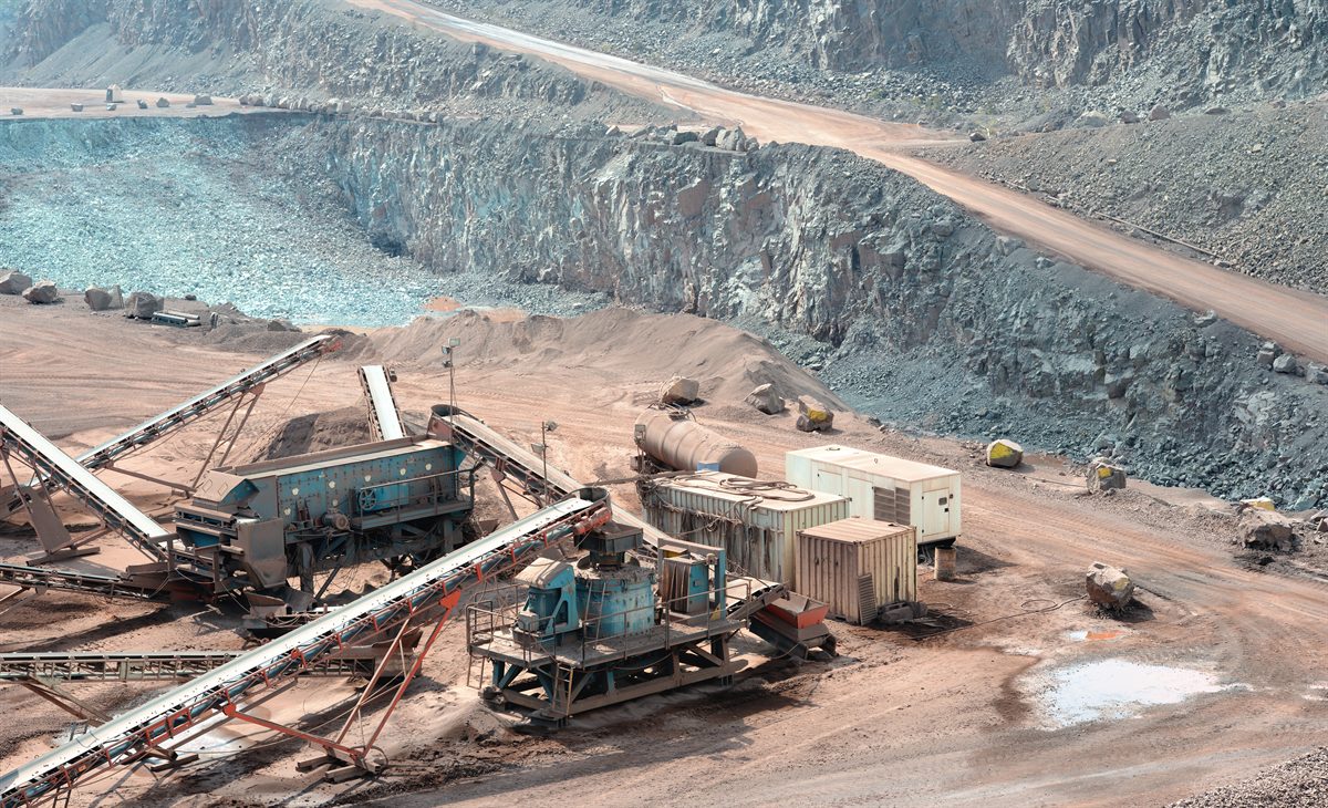 Stone crusher working in an open-pit surface mine